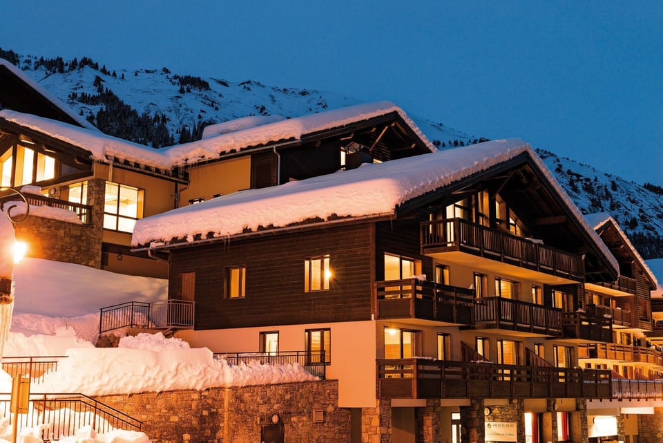 This chalet-style building features wood and stone architecture.