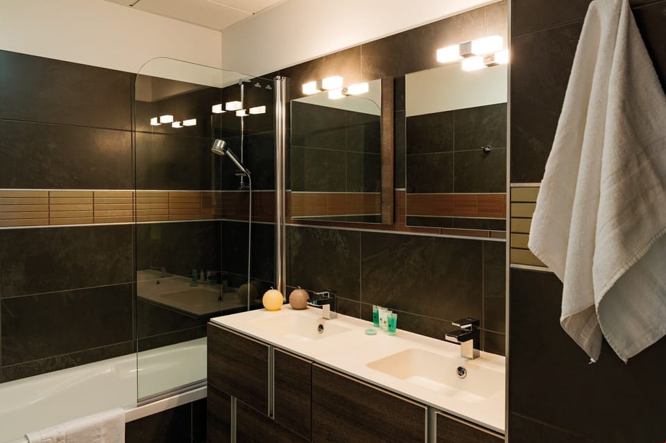 Get ready for your day in the lovely bathroom.
