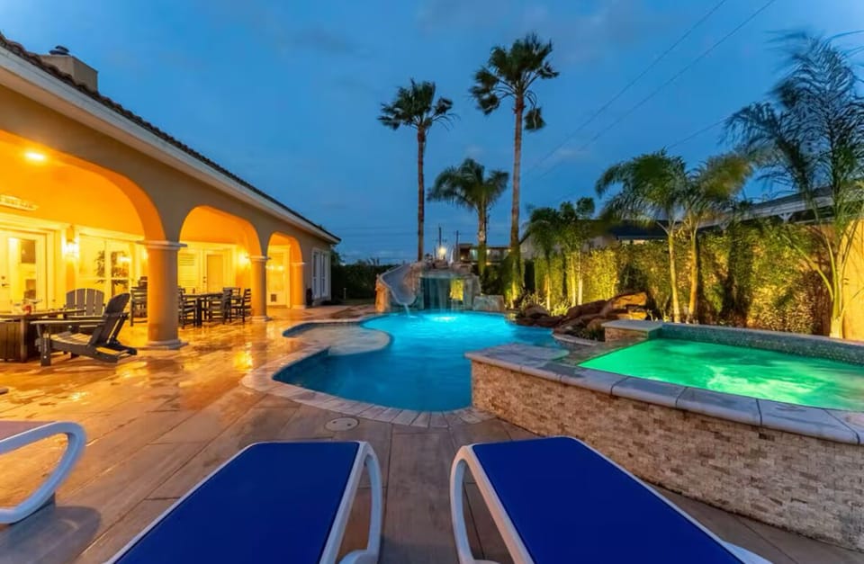 Lounging poolside with cozy lighting and comfortable chairs