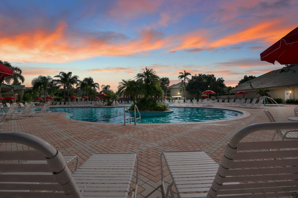 Witness stunning sunsets from the beautiful pool area, perfect for unwinding in the hot tub or soaking in the serene atmosphere.
