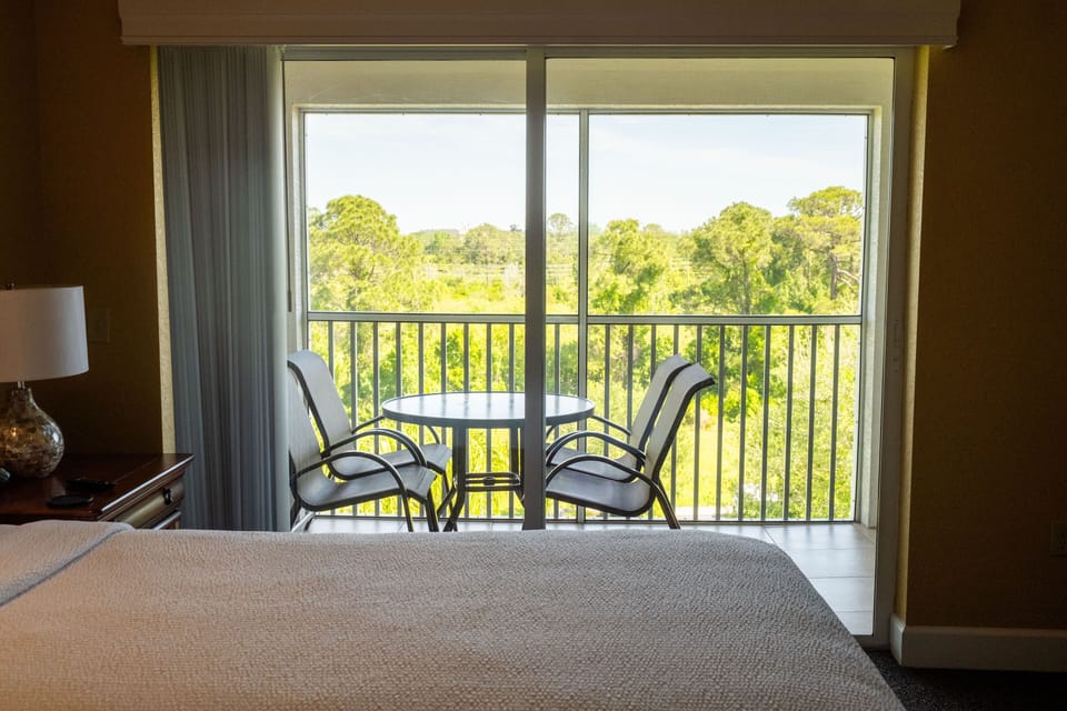 Enjoy a private furnished balcony with stunning views, inviting you to unwind in the fresh air.