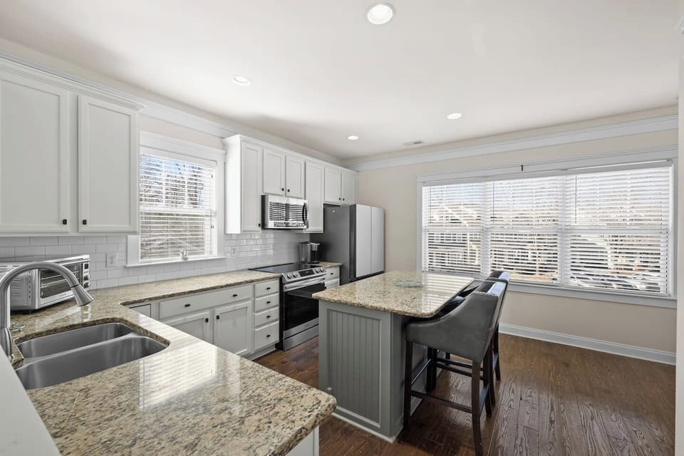 Modern kitchen - new refrigerator, microwave, & dishwasher.