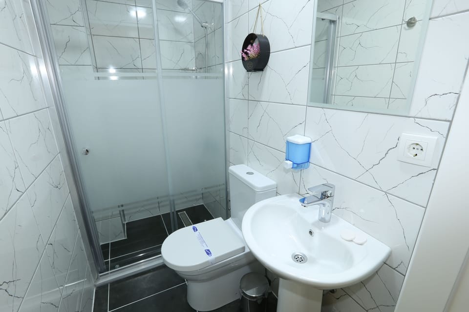 Shower, slippers, towels, soap