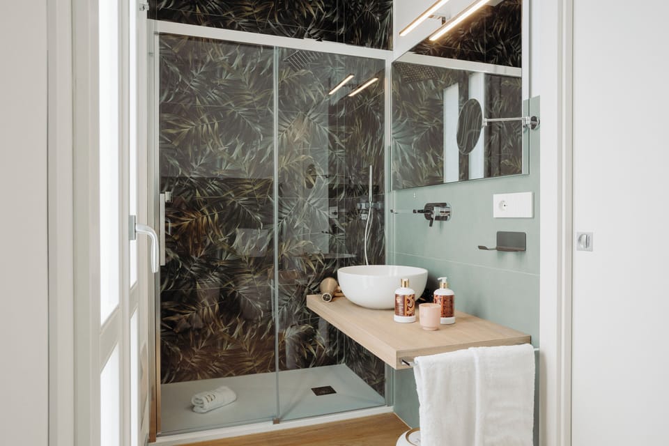 Junior Suite, Balcony | Bathroom | Shower, rainfall showerhead, hair dryer, slippers