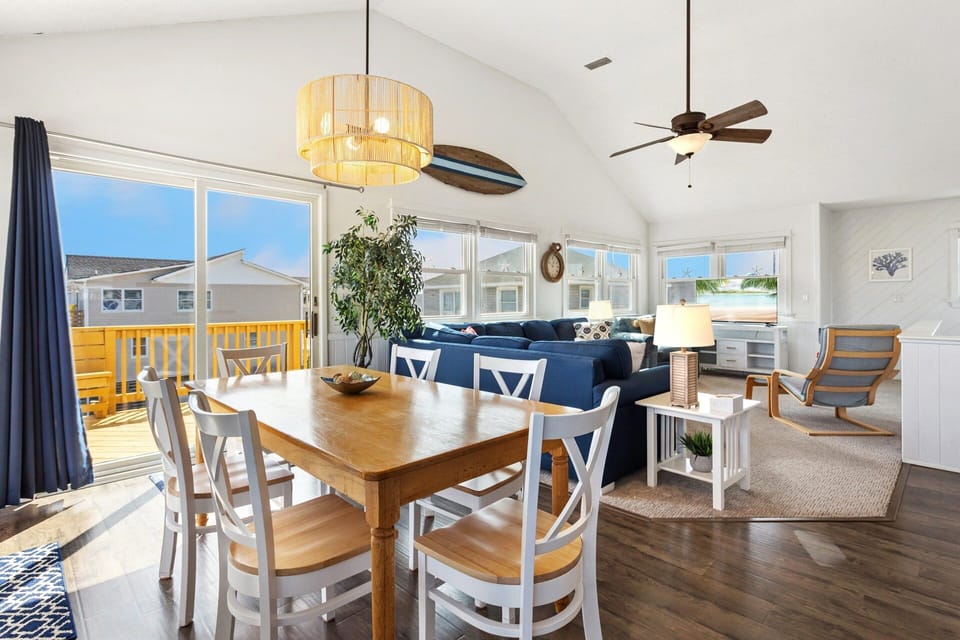 The reverse floor plan on the Top Level features an open-concept Living Area, Dining Area, and a fully equipped Kitchen, making it easy to gather, cook, and share meals with your loved ones.