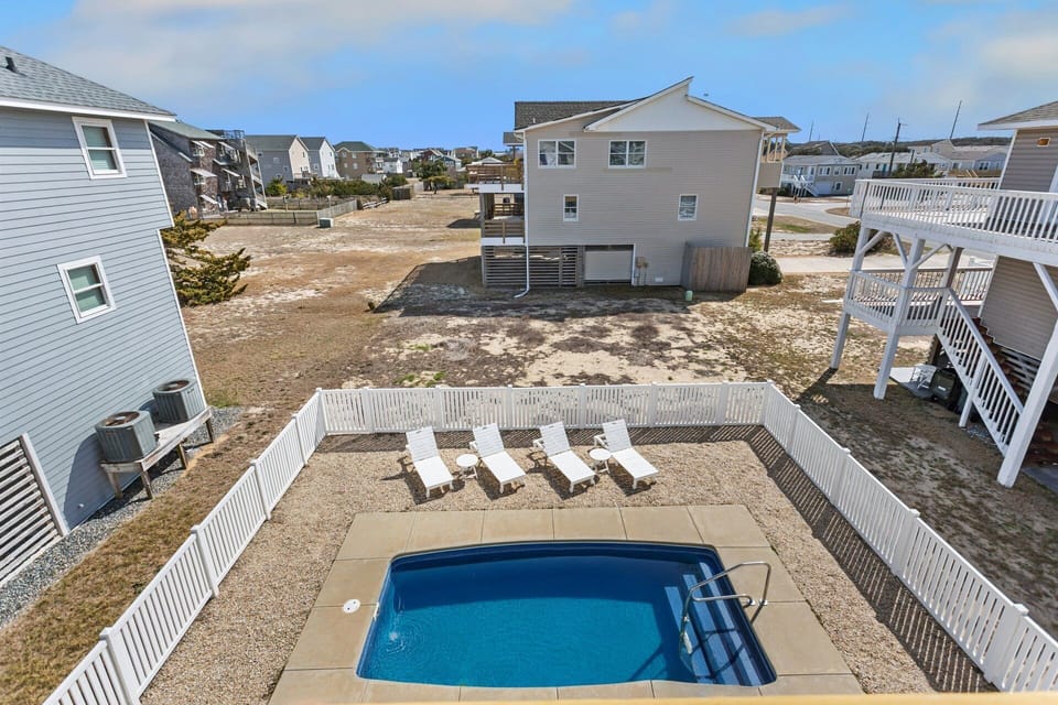 This stunning 4-bedroom, 2.5-bathroom home offers everything you need for a relaxing beach vacation, complete with a Private Pool, hot tub, and beach access across the street.