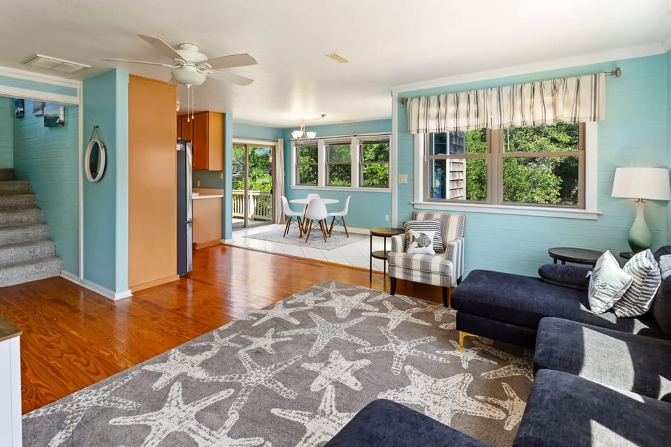 The open-concept Living Area on the Main Level features a flat-screen TV, making it a great space to unwind after a day of sun and surf! And With The adjacent Dining Area with seating for four provides the perfect spot to enjoy a home-cooked meal.