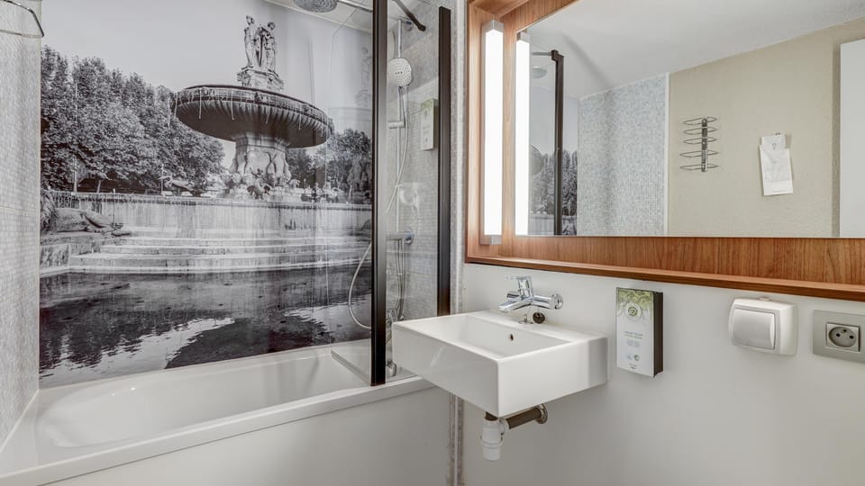 Bathtub, eco-friendly toiletries, hair dryer, towels