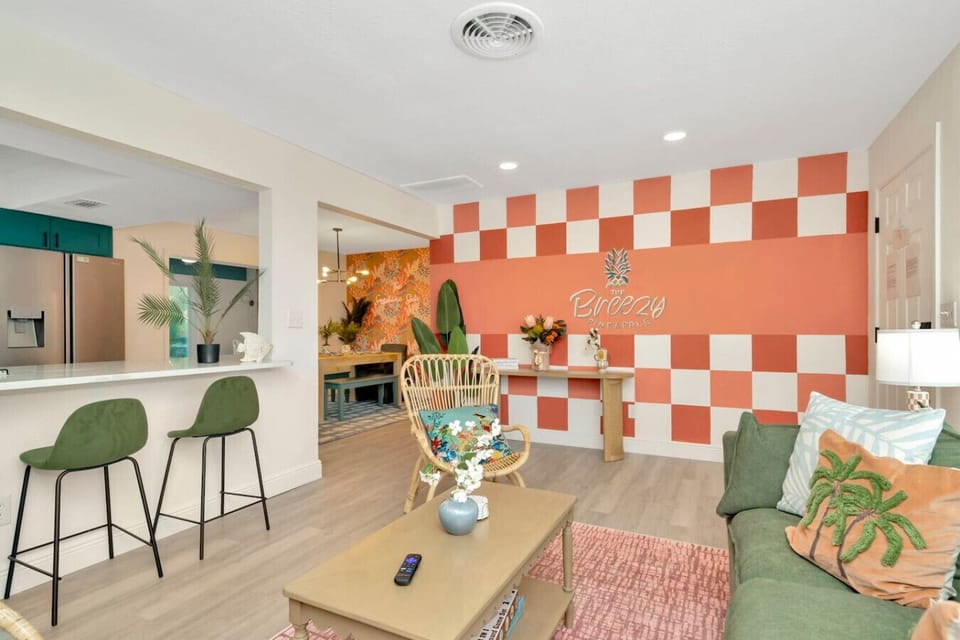 Relax in the heart of the home — the Breezy Pineapple mural adds a splash of fun and Florida color to every stay