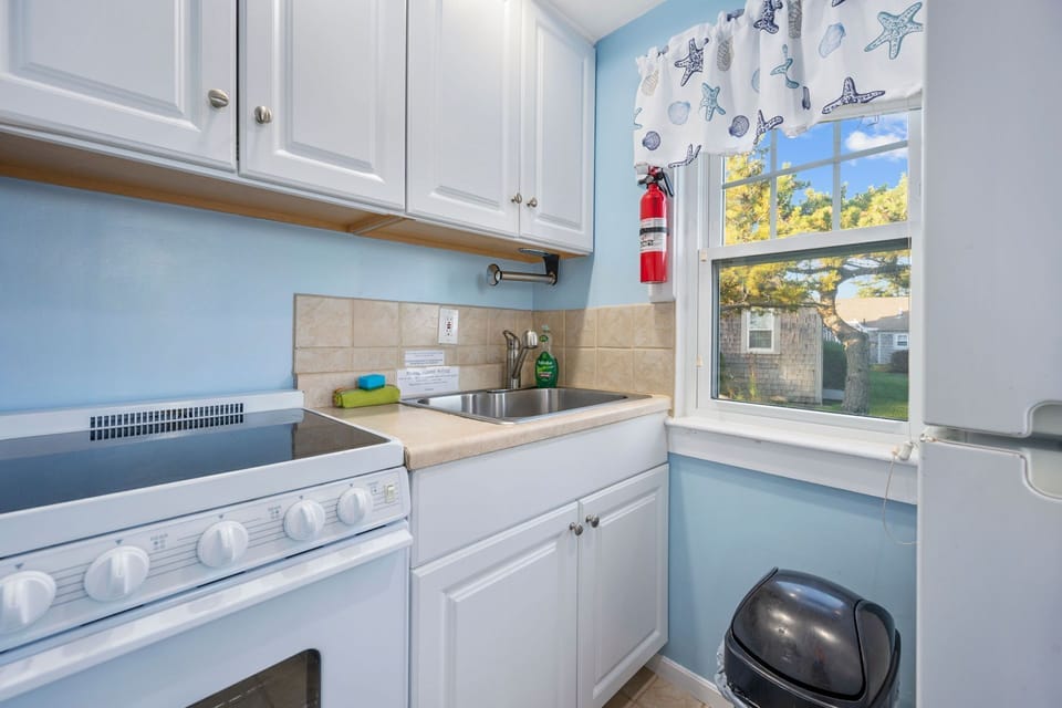 Kitchen with stove and fridge