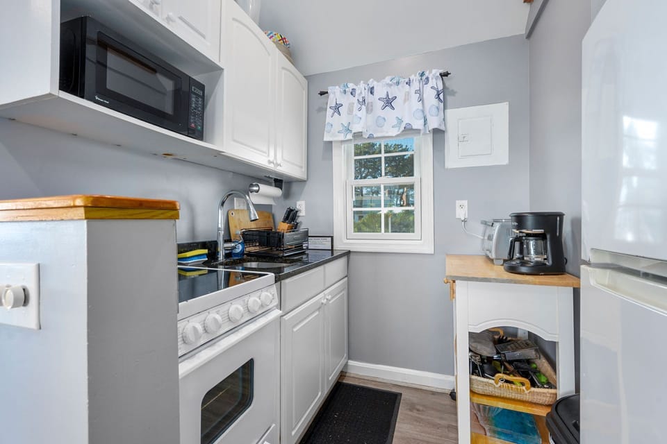 Kitchen with stove and coffee maker