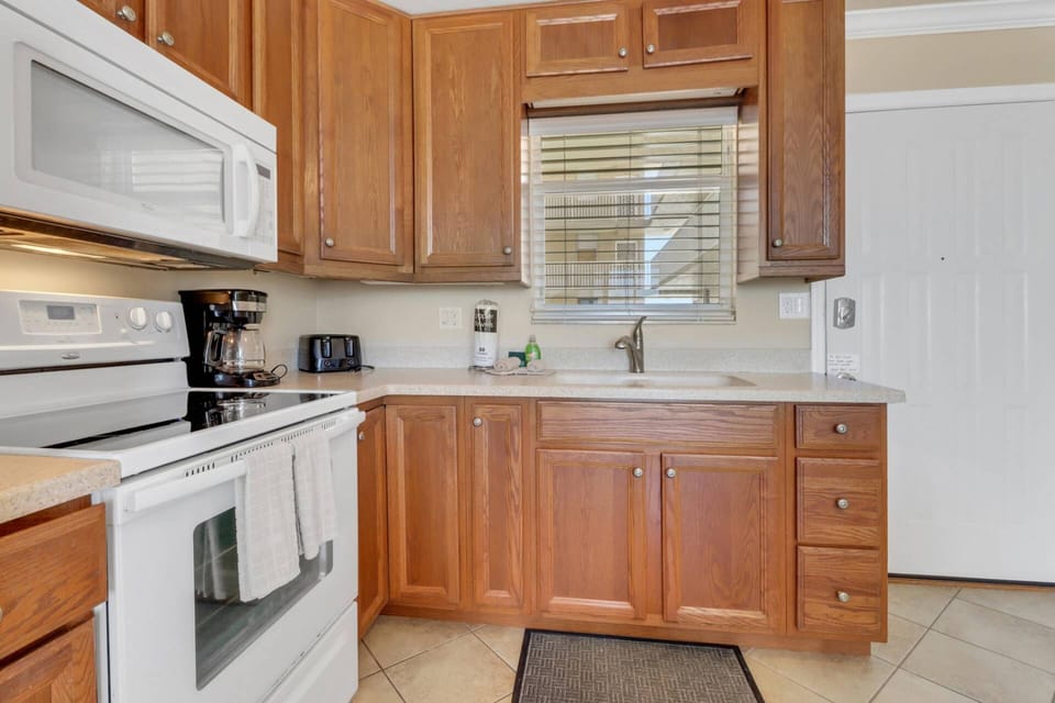 Cookware, dinnerware, many kitchen tools and small appliances are provided, including both a drip and Keurig coffee maker.