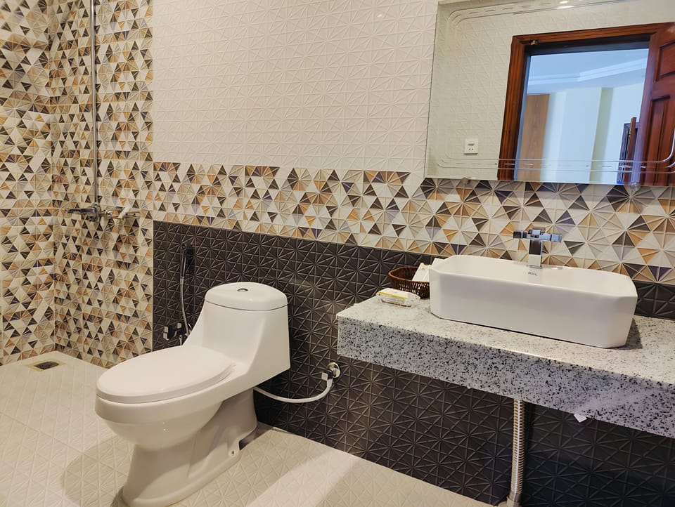 Shower, free toiletries, slippers, towels