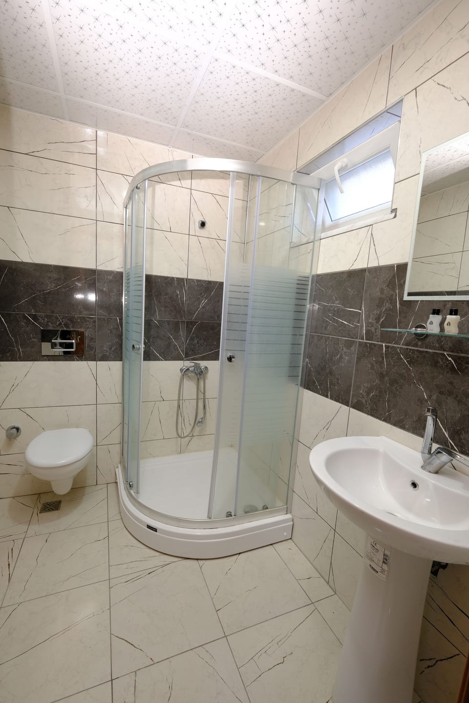 Shower, hair dryer, slippers, towels
