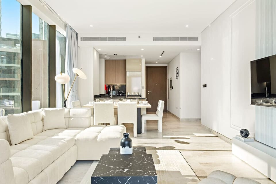 Living Room: Sunlit elegance with chic decor, perfect for relaxing with stunning city views!