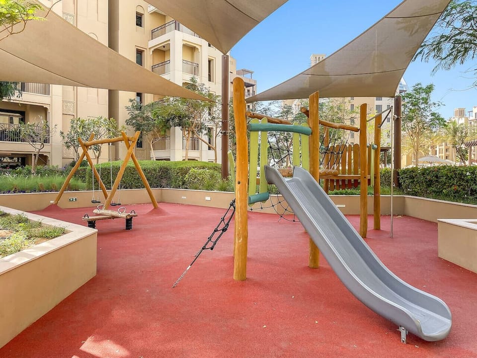 Play Area: Unleash fun with swings and slides in a vibrant outdoor paradise! Perfect for families!