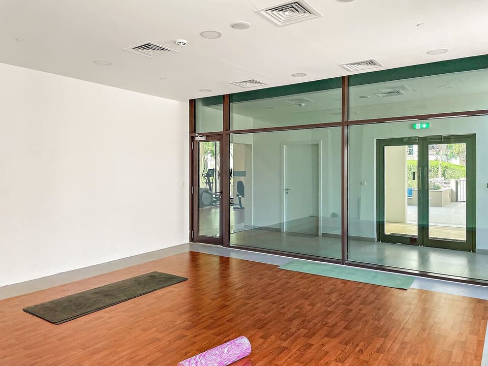 Yoga Studio: Embrace tranquility with sun-soaked windows and a spacious practice area!