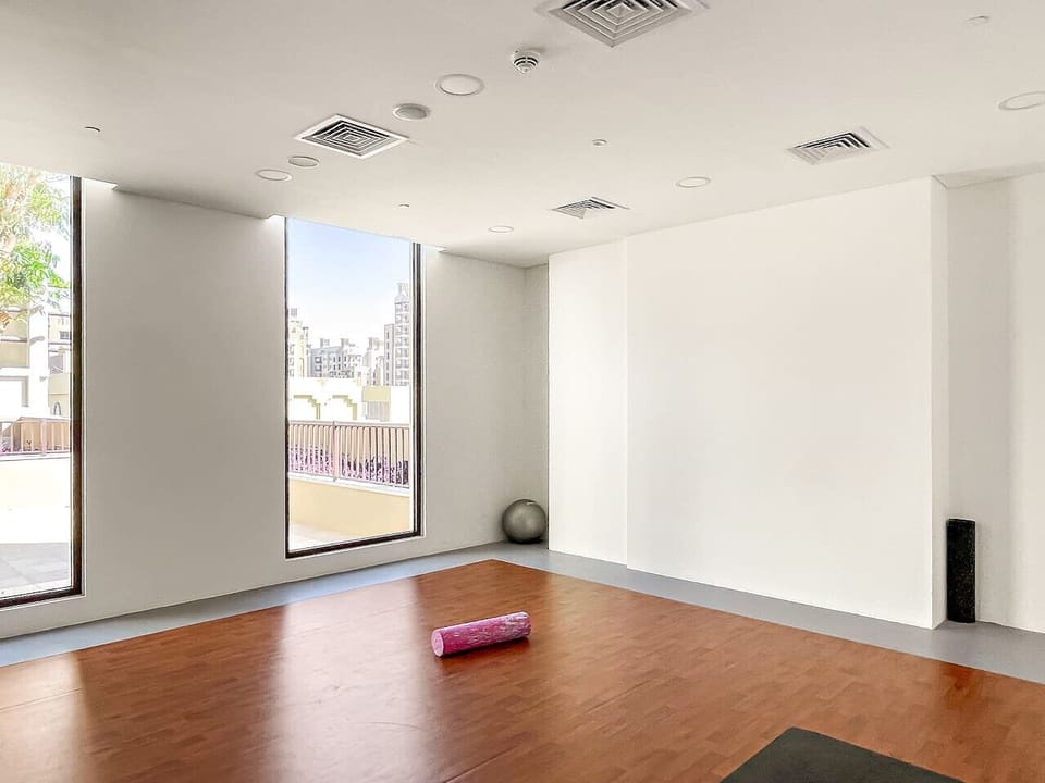 Yoga Studio: Embrace tranquility with sun-soaked windows and a spacious practice area!