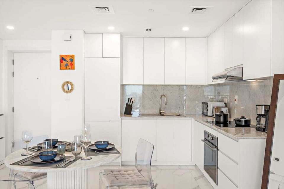 Kitchen: Sleek marble finishes and modern appliances await your culinary adventures!