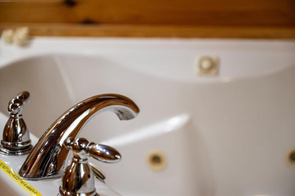 This cozy jetted tub is your perfect mountain retreat reset—just add bubbles and bliss.
