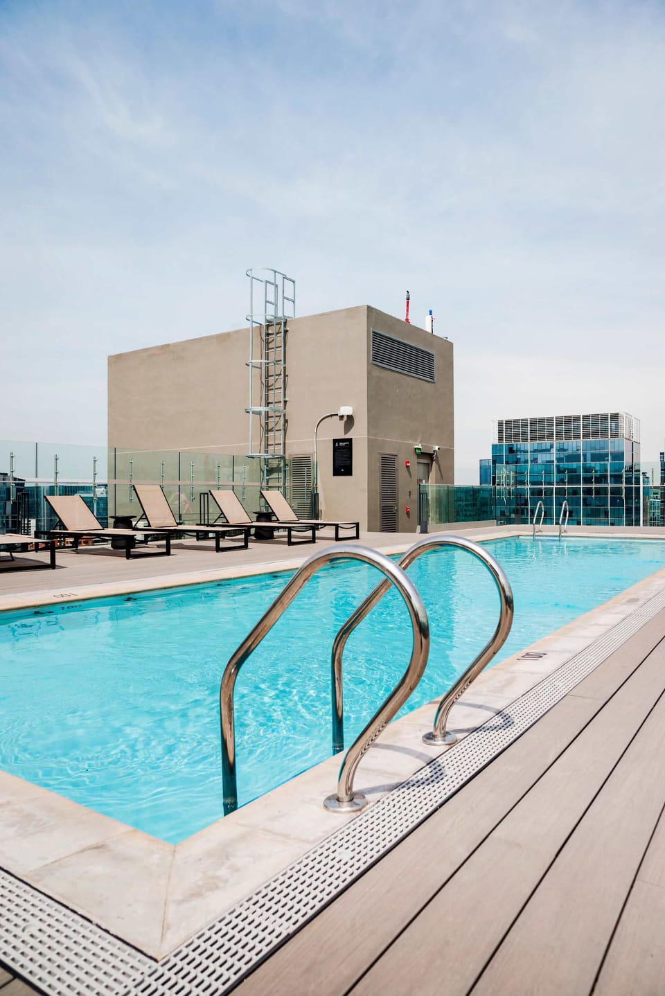 Enjoy a refreshing swim in the rooftop pool with stunning city views.