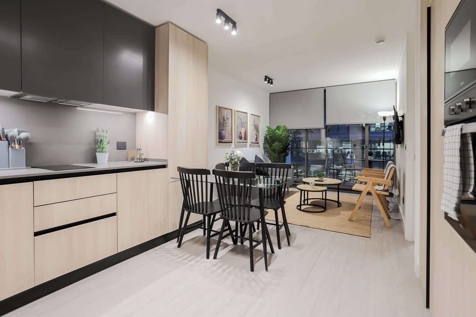 Experience modern elegance in this stylish kitchen and dining area, perfect for cozy dinners and entertaining.