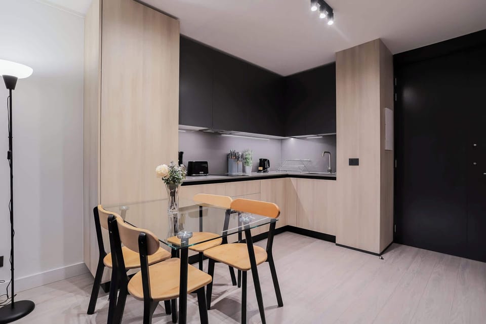 Sleek modern kitchen with stylish dining area, perfect for cozy meals and culinary adventures.