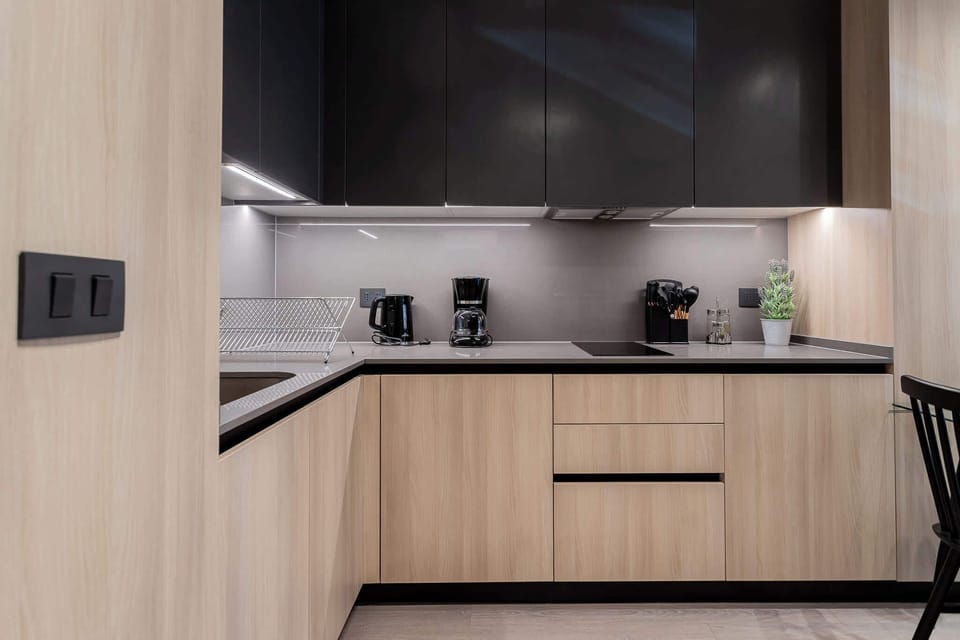 Experience a sleek and modern kitchen equipped with essential appliances, perfect for your culinary adventures during your stay!
