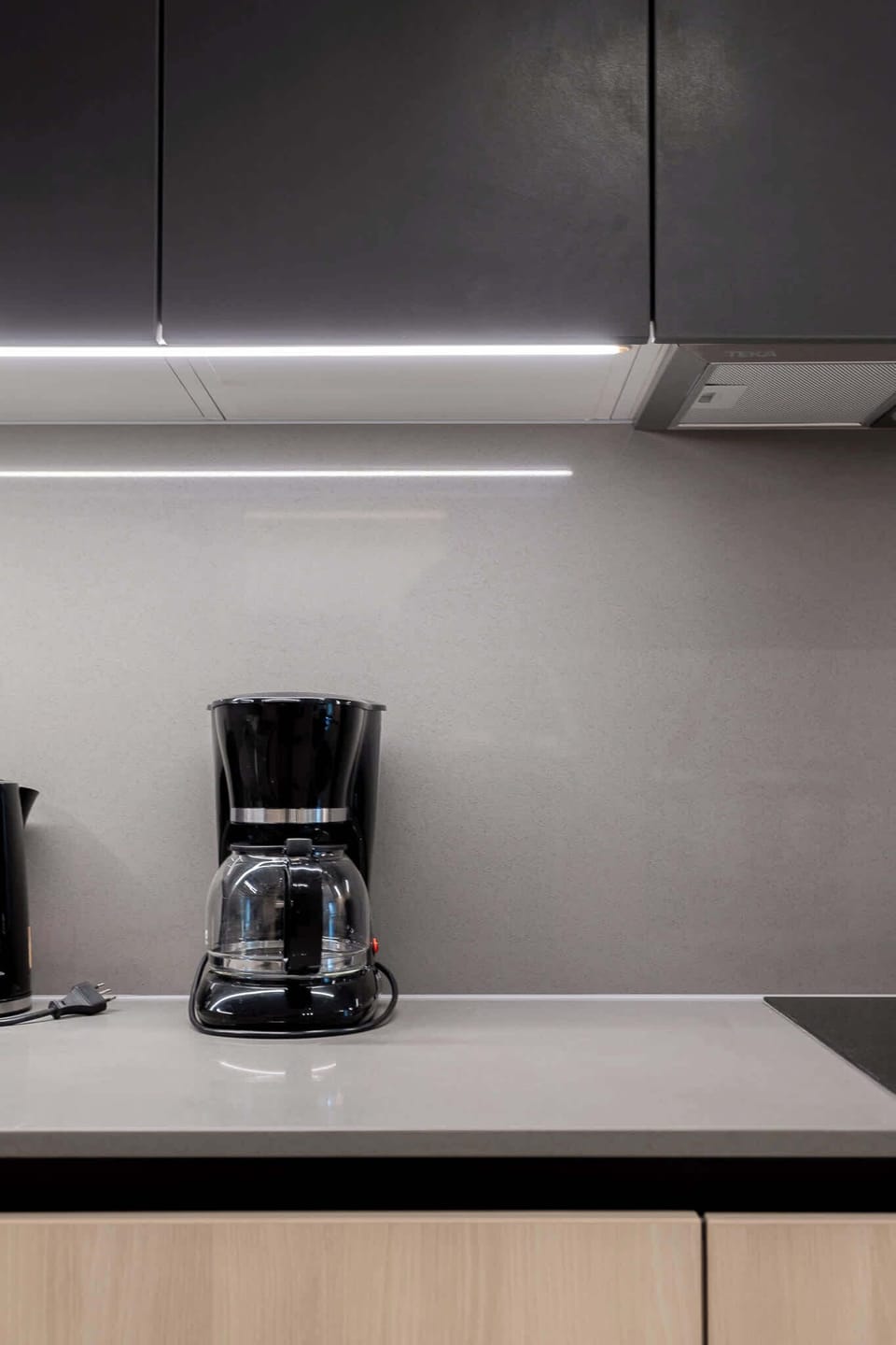 Enjoy a sleek and modern kitchen equipped with essential amenities for your culinary adventures.