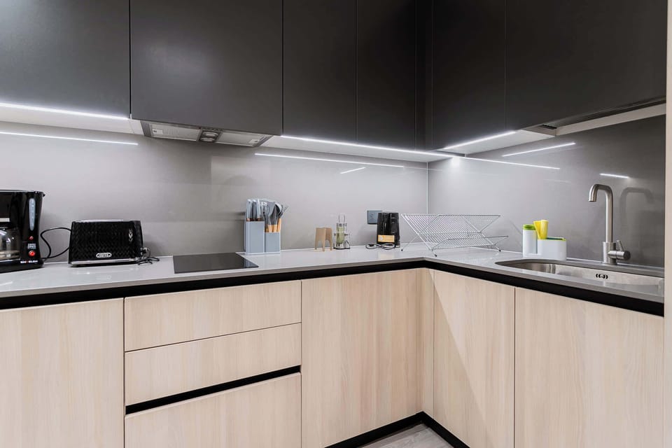 Sleek and modern kitchen with top-notch appliances and ample counter space for your culinary adventures.