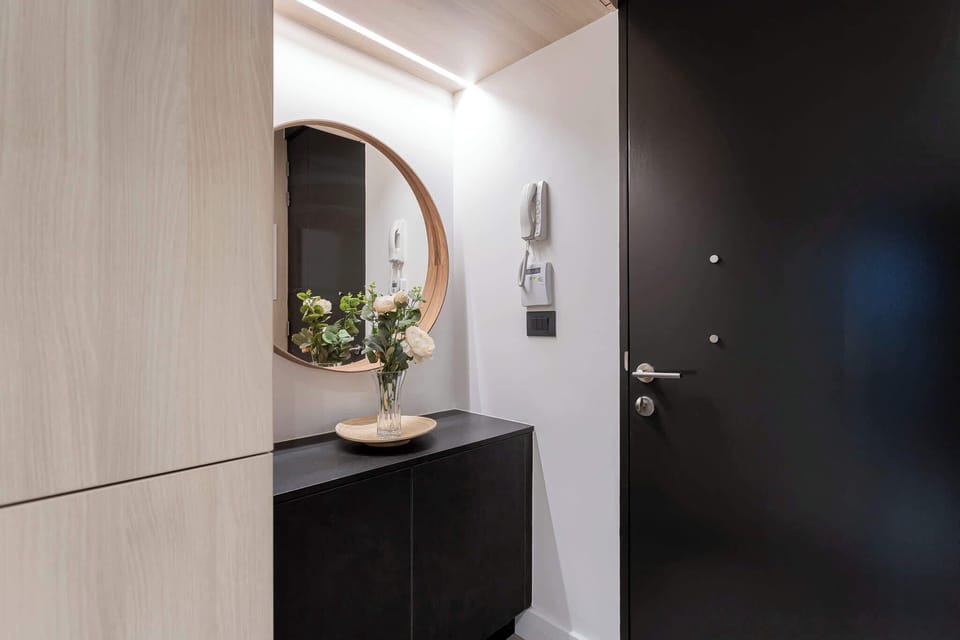 Welcome to your stylish retreat! This modern entryway sets the tone with chic decor and a welcoming vibe.