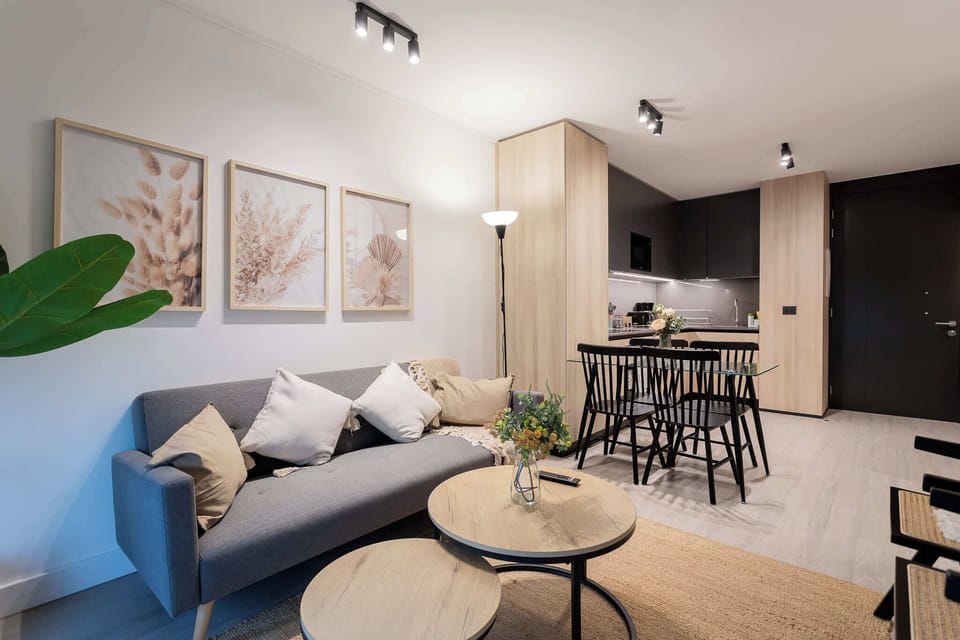 Cozy living space with modern kitchen and dining area, perfect for relaxation and entertaining in style.