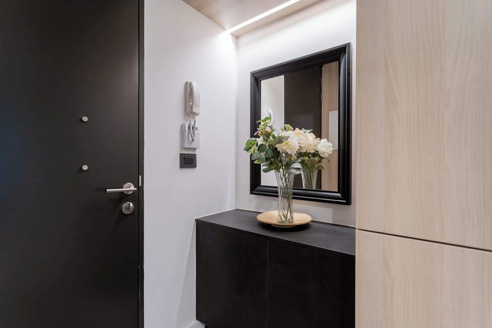 Welcome to your stylish retreat! This chic hallway sets the tone with modern decor and a touch of elegance.
