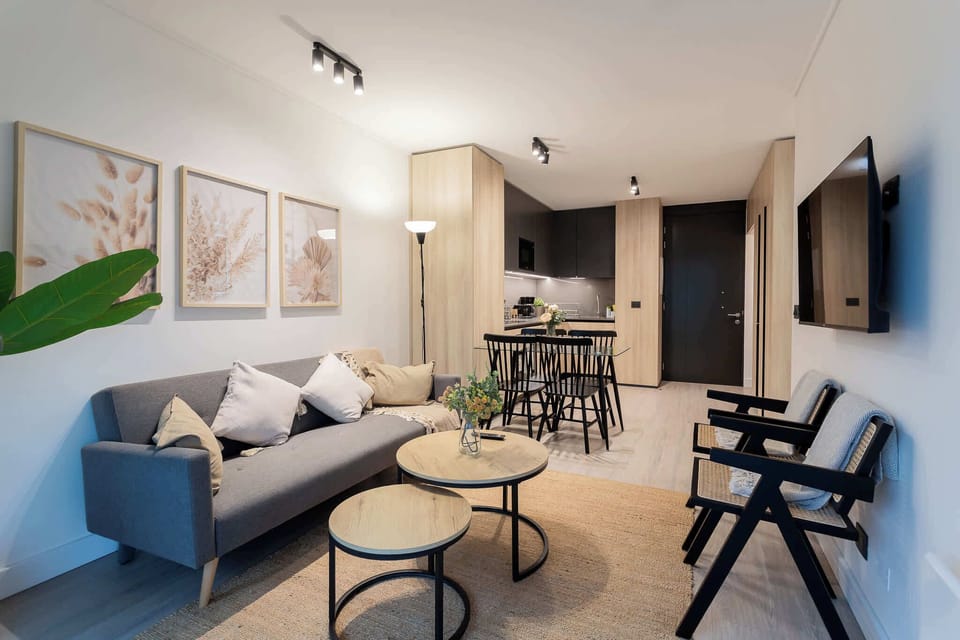 Stylish living space with cozy seating, chic dining area, and modern decor—perfect for relaxation and entertaining.