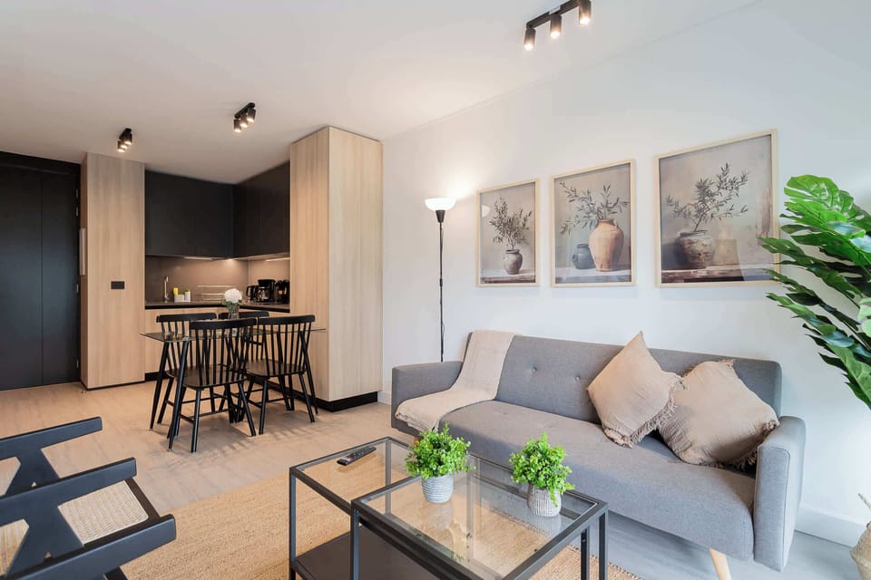 Experience modern comfort in this stylish living space, featuring elegant decor and a cozy atmosphere perfect for relaxation.