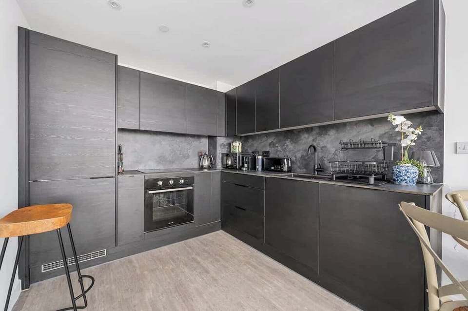 Open plan kitchen and dining area with breakfast bar, fully equipped with everything you need for a comfortable stay