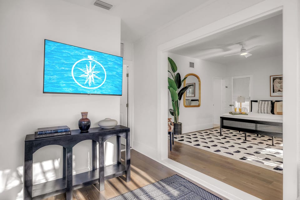 Bedroom Two on the first floor boasts a king size bed, office nook,  sleeper sofa, ensuite bathroom with a shower