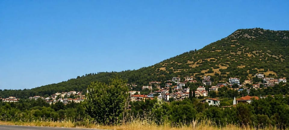 Scenic Mountain and Countryside View under Clear Skies