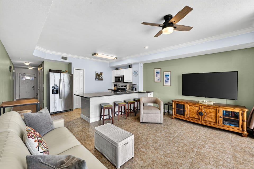 Open-concept living area with a modern kitchen and comfortable seating.
