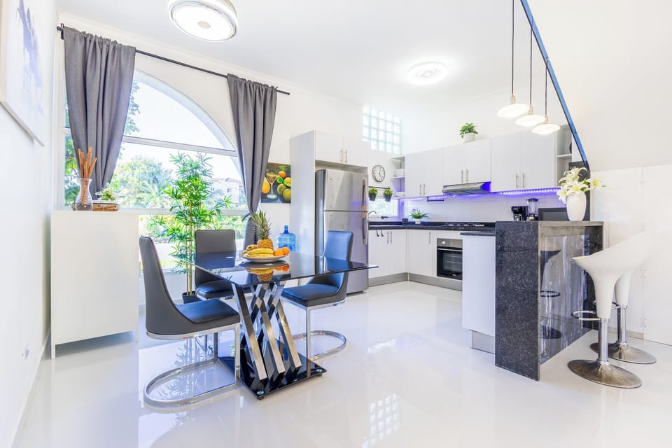 There is a fully equipped kitchen with modern appliances.