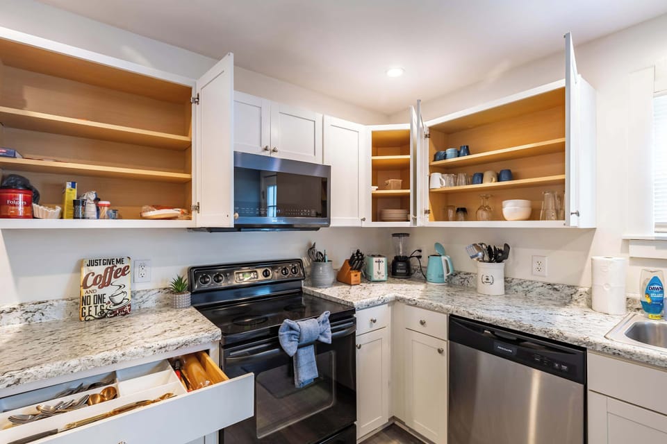 A fully equipped kitchen with cookware, dishes, and appliances to make cooking feel simple and stress-free.