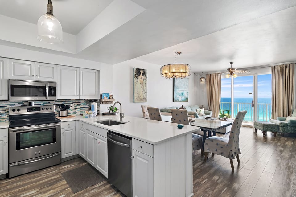 Kitchen has GULF VIEWS, granite countertops, stainless appliances - fully stocked with more than the basics (coffee/tea bar, oils/salt and pepper, Tupperware, plenty of pots/pans/cookware)