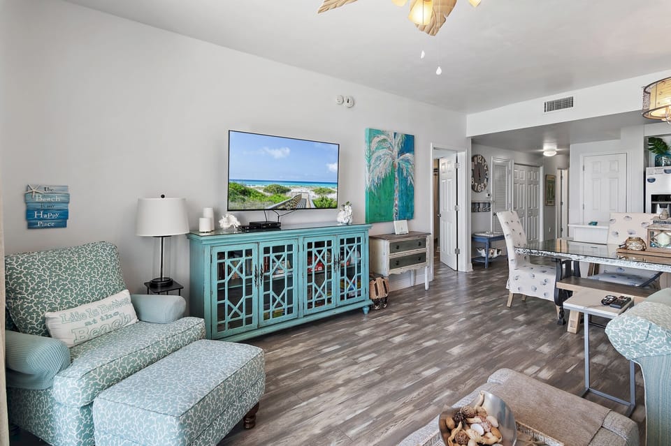 Open Living Space and Gulf View Dining! This condo is updated with new flooring, furniture, and furniture + incredibly appealing, coastal decor!