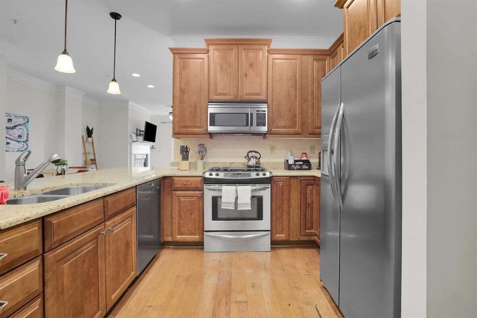 Start your day or share a snack at the spacious kitchen bar—seating for four makes it the perfect spot for casual bites and conversation.