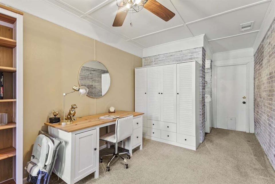 The office features a spacious desk and extra storage, perfect for work or keeping things tidy during your stay