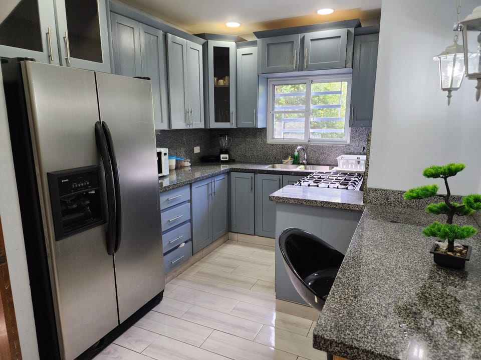 stovetop, refrigerator, coffee and or coffee maker, indoor.