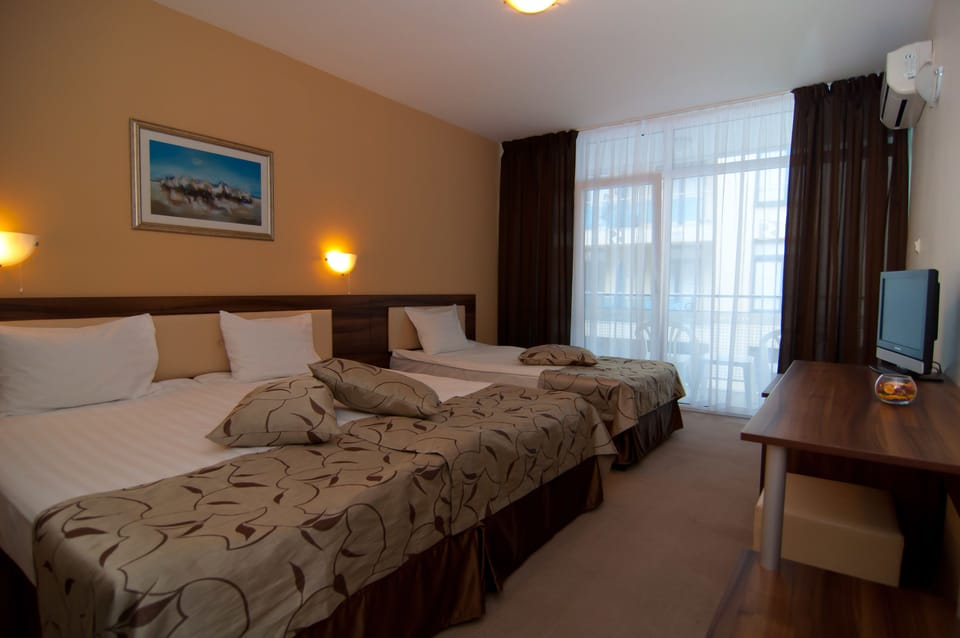 Standard Triple Room | Premium bedding, minibar, desk, blackout drapes
