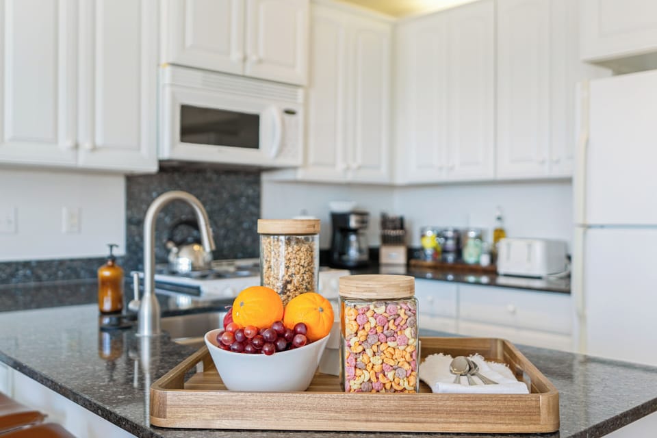 The kitchen is stocked with a variety of essentials, making it easy to whip up any meal and enjoy food galore!
