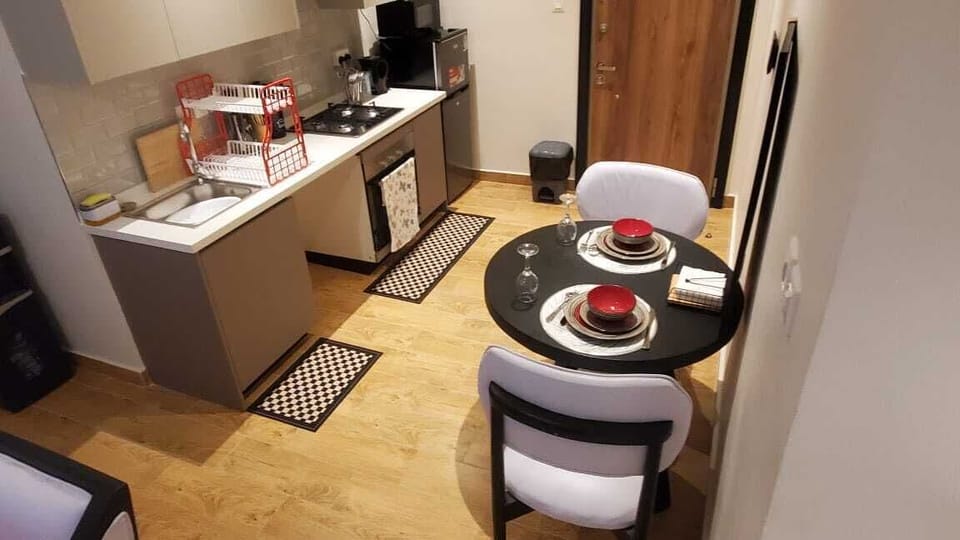 Deluxe Apartment, Balcony, City View | Private kitchen | Microwave, cookware/dishes/utensils