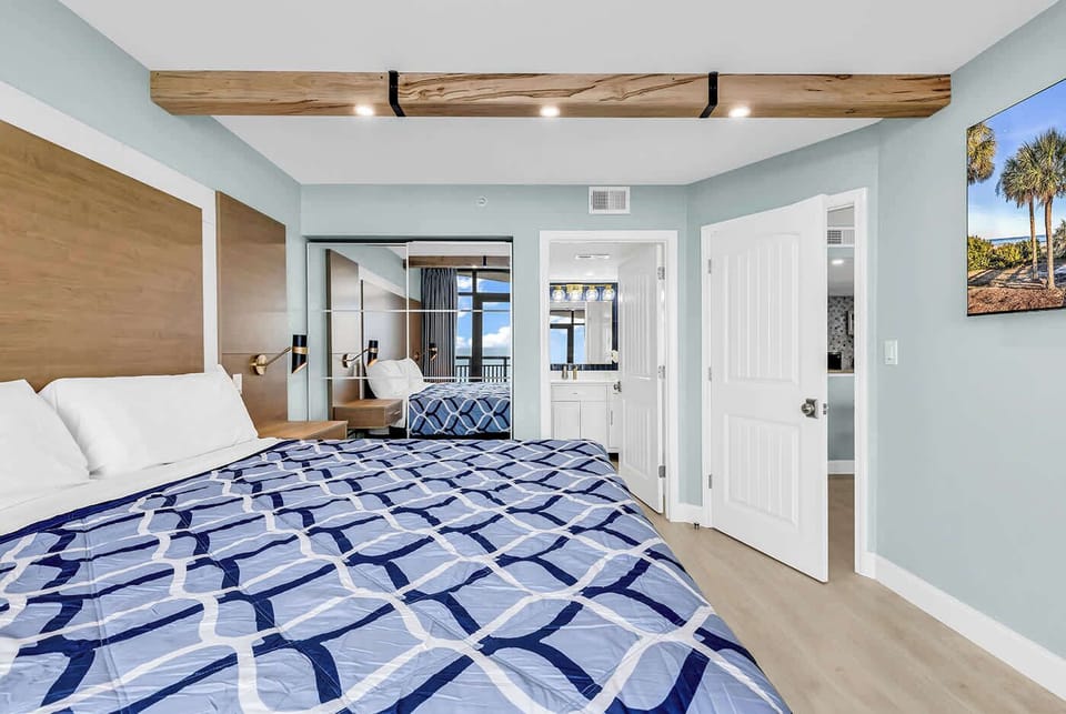 Master Bedroom offers beautiful ocean views. Ask Amazon Alexa to close the curtains or lower the temperature in the condo.